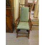 A 20thC American style, stained beech framed rocking chair