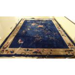 A Chinese washed woollen carpet, traditional decorated on an ocean blue coloured ground  126" x 170"