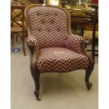 A late Victorian walnut showwood framed spoonback grandfather chair with enclosed arms,