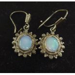 A pair of 9ct gold and opal pendant earrings