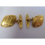 A pair of gold coloured metal, engraved tablet and chain cufflinks