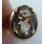 A 9ct gold claw set ring, set with a smoky quartz