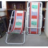 A set of four circa 1970s white metal framed and canvas bound folding terrace loungers/deckchairs