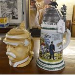Two German novelty china tankards, one featuring the Kaiser, the other with military associations