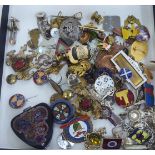 Items of personal ornament: to include a white metal charm bracelet with attendant charms; a