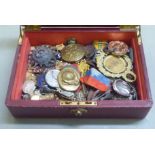 An uncollated collection of silver, bronze and base metal medallions, badges and other insignia,