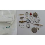 Items of personal ornament: to include silver coloured metal rings; a 9ct gold bar brooch,