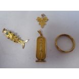 A 9ct gold wedding ring; and three gold coloured metal pendants, viz. a maple leaf; a