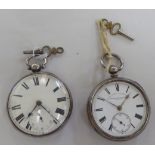 Two similar silver cased pocket watches, faced by white enamel Roman dials