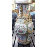 A Canton porcelain vase of waisted bulbous form, traditionally decorated with figures on a