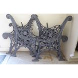 Two pairs of painted cast iron bench ends (only)