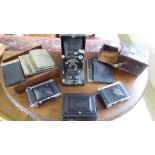 Vintage photographic equipment: to include a Lodel plate camera, in a stitched hide case