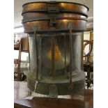 An early 20thC Seahorse copper finished ship's masthead lantern with an electric light fitting and a