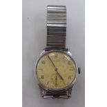 A vintage Longines stainless steel cased wristwatch, faced by a baton and Arabic dial