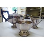 A silver plated three piece tea set of octagonal, tapered, pedestal design