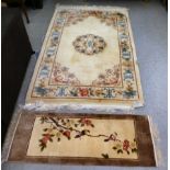 A Chinese washed cotton floral pattern rug, on a cream coloured ground  48" x 80"; and a similar mat