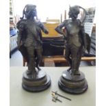 A pair of late 19thC spelter figures, Roman soldiers, on ebonised plinths  24"h