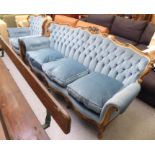 A modern Italianate design beech framed showwood three person settee, carved with scrolls and part