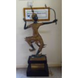 An Asian patinated green bronze and parcel gilt dancing figure wearing traditional costume  40"h, on