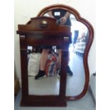 A modern cartel mirror, the shaped plate in a moulded mahogany frame  31" x 21"; and a Biedermeier