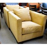 A pair of modern sand coloured, suede effect, box armchairs with loose cushion seats