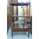 An early Victorian rosewood, three tier whatnot with a fretworked gallery and finials, raised on