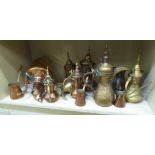 Middle Eastern copper and brassware: to include coffee pots and measures