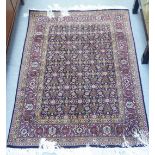 A Persian design part-silk rug, decorated profusely with flora, on a multi-coloured ground  42" x