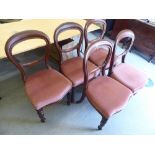 A set of five late Victorian mahogany framed balloon back dining chairs, the upholstered seats