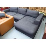 A modern two-part L-shape three person settee, upholstered in cushioned charcoal coloured fabric