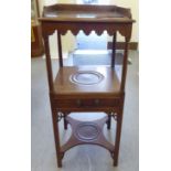 A 19thC mahogany two tier washstand with a frieze drawer and undershelf  32"h  14"w