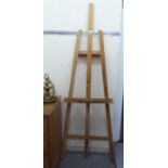 An artist's beech framed height adjustable studio easel, on a folding stand  75"h