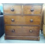 A late Victorian mahogany three drawer dressing chest with bun handles, on a plinth  36"h  36"w