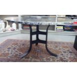 A modern mottled, black and white marble topped table, on a cast matt black iron underframe  30"h