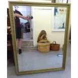 A modern mirror, the bevelled plate set in a moulded gilt frame  51" x 39"