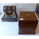 A late 19thC brass bound walnut inkstand; and a late 19thC oak four section decanter box with