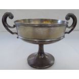 A silver twin handled pedestal trophy cup  London marks  1909  5"h
