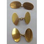 A pair of 9ct gold oval tablet and chain cufflinks; and a single cufflink of similar design