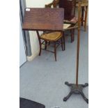 A late Victorian freestanding lectern, the height and angle adjustable oak plate with paper
