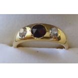 An 18ct gold, rubover set ruby and diamond ring