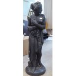 A black painted composition stone garden statue, 'Pandora' with her box  46"h