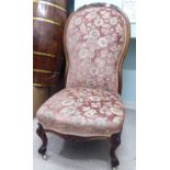 A mid 19thC Continental rosewood framed salon chair with a floral fabric upholstered back and
