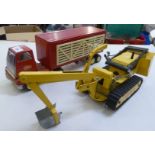 1950s/1960s metal Tonka toys, viz. a cattle transporter  5.5"h; and a trench-digger with an