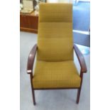 A Parker Knoll mahogany painted showwood framed open arm chair, upholstered in old gold coloured