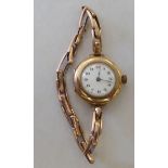 A lady's 9ct gold cased wristwatch, faced by an Arabic dial