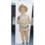 An early/mid 20thC printed cut-out card figure of a child with a baby doll  33"h on a wall hanger
