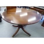 A modern reproduction of a Regency mahogany pedestal table, raised on a splayed quadruped base  29"h