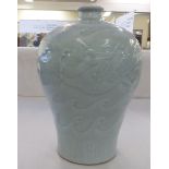 A mid 20thC Chinese celadon glazed pottery vase of bulbous, tapered form, decorated with waves  12"h