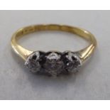 An 18ct gold three stone diamond ring