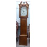 An early 20thC pine cased grandfather clock; the Arabic dial, incorporating a twenty-four hour